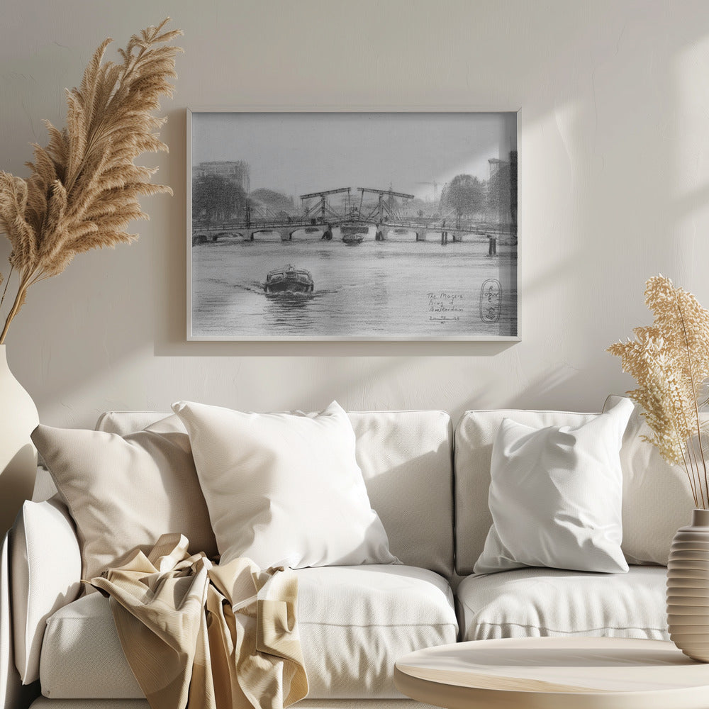 A framed black and white pencil drawing of the Magere Brug, a famous bridge in Amsterdam. The drawbridge is depicted over a canal with a boat in the foreground, creating a classic European city scene. Wall Art