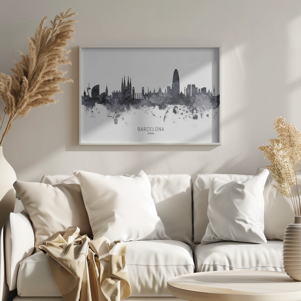 A framed black and white watercolor silhouette of the Barcelona, Spain skyline. Famous landmarks like the Sagrada Familia and Torre Glòries are visible. The word 'BARCELONA' is printed below the cityscape against a clean white background. Poster