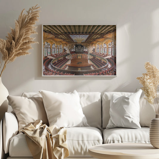 A high-angle, wide shot of the ornate and lavish interior of the Palau de la Música Catalana in Barcelona. The view captures the entire concert hall, with its curved balconies filled with red seats, a central wooden stage with a grand piano, and a spectacular, large stained-glass skylight in the ceiling. Poster