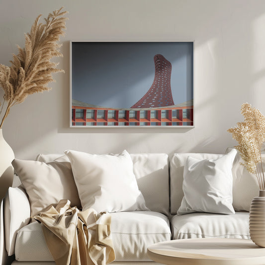 A modern architectural photograph showing a curved, maroon skyscraper twisting towards the sky against a gradient grey background. A lower, orange, grid-like building curves along the bottom of the frame. The entire scene is enclosed in a silver frame. Poster