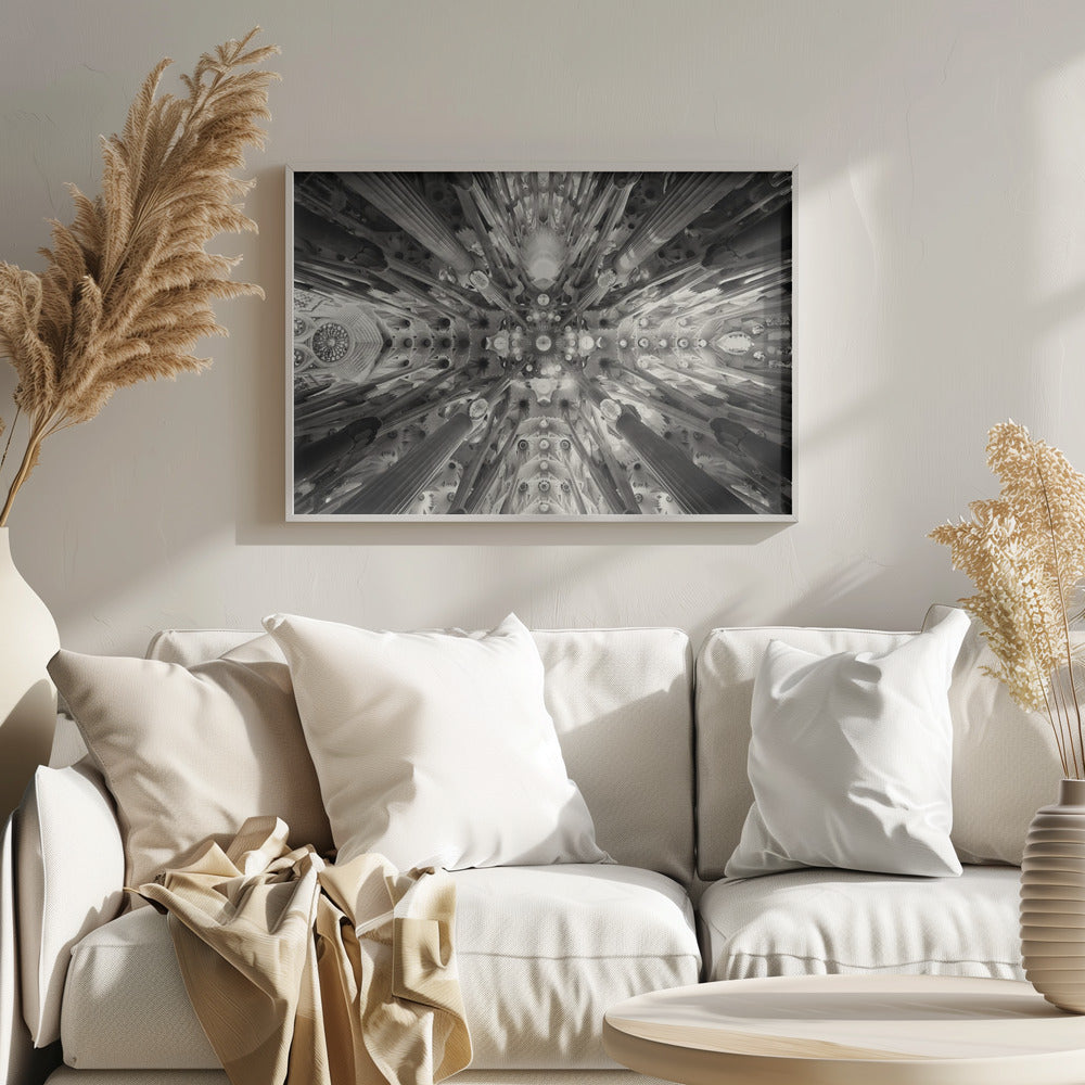 A framed black and white photograph captures the breathtaking, symmetrical ceiling of Gaudí's Sagrada Familia basilica, viewed directly from below. The massive columns rise and branch out like a forest canopy, creating a complex and mesmerizing architectural pattern of vaults, ribs, and skylights. Artwork