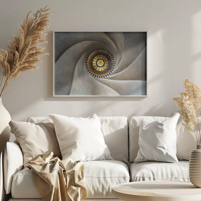 A low-angle, centered photograph looking up at an ornate, golden sunburst chandelier hanging from the vortex of a swirling, textured cream-colored ceiling, enclosed in a silver frame. Poster