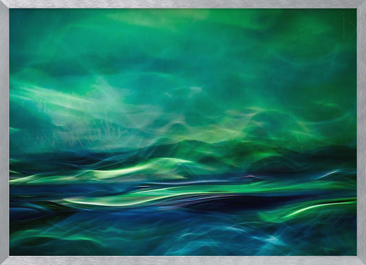 A framed abstract artwork featuring a luminous, dreamlike landscape of swirling green and blue light. The top half glows with a vibrant green haze like the northern lights, while the bottom half depicts dark blue and green waves with bright, energetic highlights, creating a sense of mystical water and sky. Wall Art