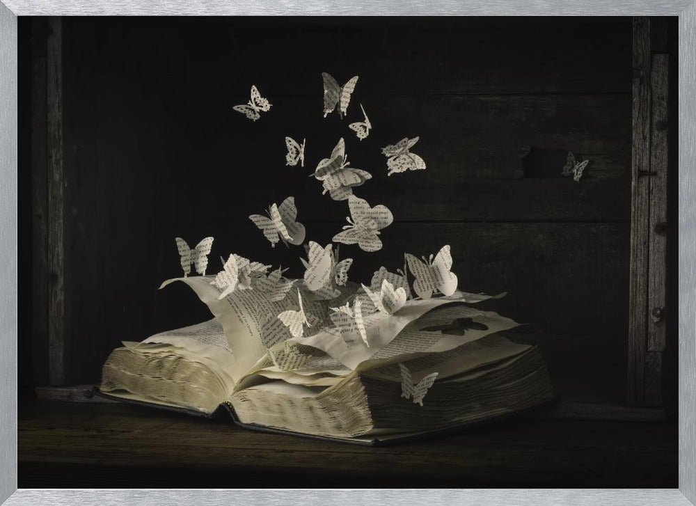 A conceptual artwork depicting an open vintage book on a dark wooden table. Dozens of butterflies, crafted from the book's own printed pages, are emerging and flying upwards as if the story is coming to life against a dark, rustic background. Artwork
