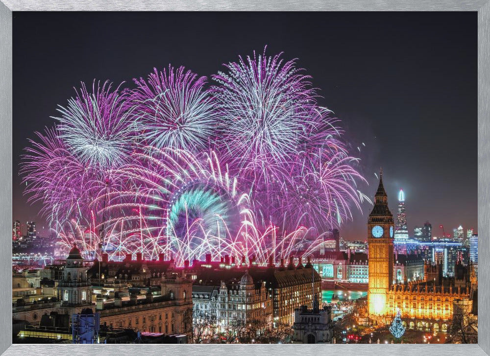 A vibrant night-time cityscape of London featuring a massive fireworks display in purple, pink, and white exploding over landmarks like the London Eye and the illuminated Big Ben clock tower, all within a silver frame. Decor
