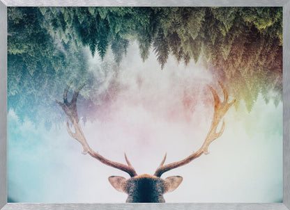 A surreal double-exposure artwork featuring the back of a deer's head with large antlers, blended with an image of a misty pine forest. The forest is reflected above the antlers against a soft, pastel-colored background, all enclosed in a silver frame. Print