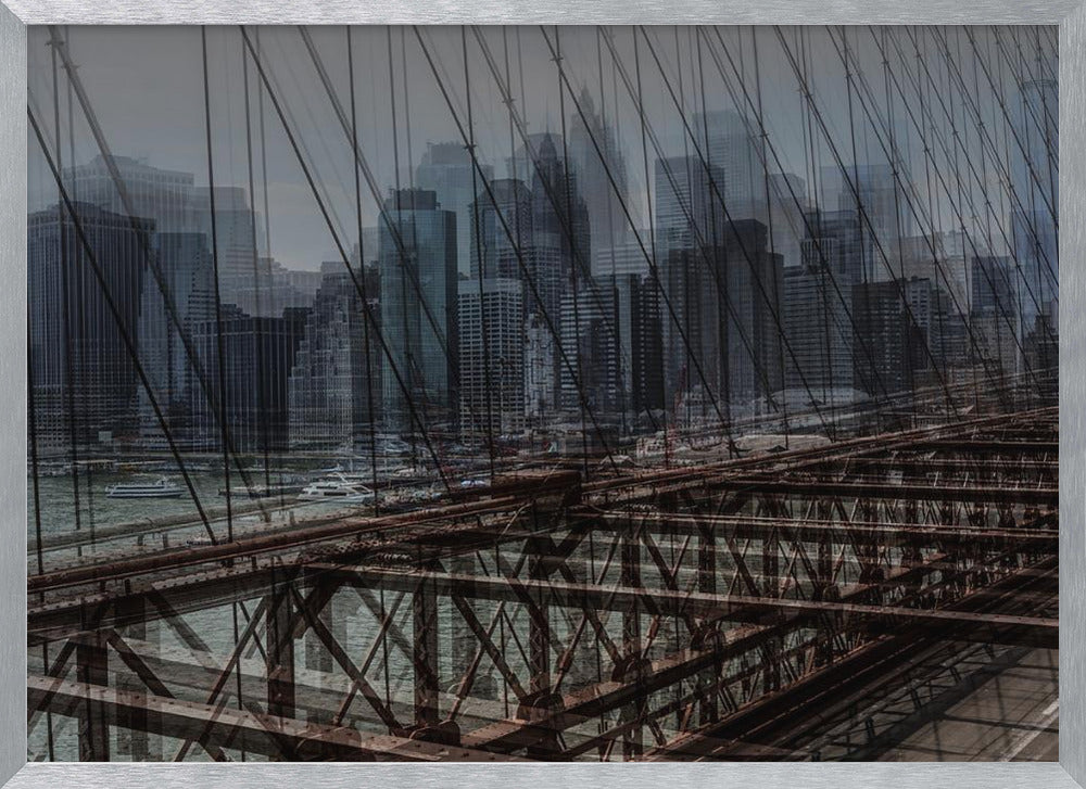 A framed, stylized photograph showing a double exposure of the New York City skyline and the intricate steel structure and cables of the Brooklyn Bridge, creating a dense, layered urban scene with a cool, moody color palette. Decor