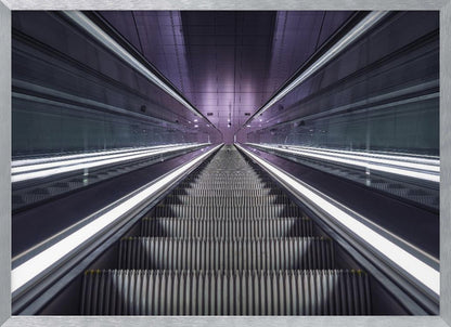 A symmetrical, first-person view looking down a long, empty escalator in a modern subway station, with bright white lights lining the handrails and a purple glow on the ceiling, creating a futuristic and infinite perspective. Wall Art