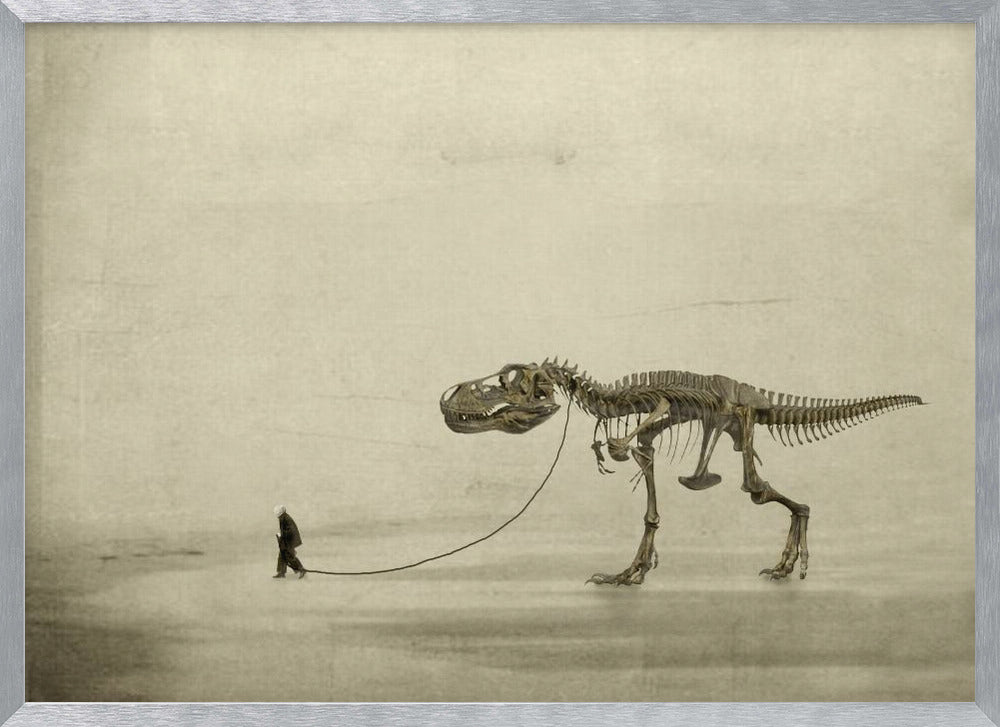 A surreal, sepia-toned artwork depicting a small man in a dark coat walking a massive Tyrannosaurus Rex skeleton on a leash against a minimalist, textured beige background, all within a silver frame. Wall Art