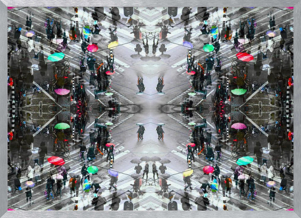 A symmetrical, kaleidoscopic abstract artwork created from an aerial view of a rainy city intersection. The mostly black and white image features pops of vibrant color from numerous umbrellas held by pedestrians crossing the street, all framed in a textured silver border. Artwork