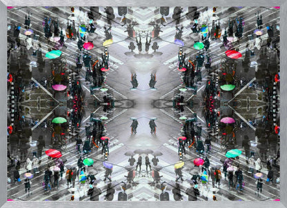 A symmetrical, kaleidoscopic abstract artwork created from an aerial view of a rainy city intersection. The mostly black and white image features pops of vibrant color from numerous umbrellas held by pedestrians crossing the street, all framed in a textured silver border. Artwork