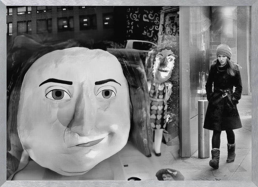A surreal black and white photograph with a silver frame, featuring a giant, cartoonish head of a historical figure reflected in a window, juxtaposed with a young woman in a winter coat and beanie walking down a city sidewalk. Wall Art