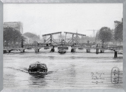 A framed black and white pencil drawing of the Magere Brug, a famous bridge in Amsterdam. The drawbridge is depicted over a canal with a boat in the foreground, creating a classic European city scene. Wall Art