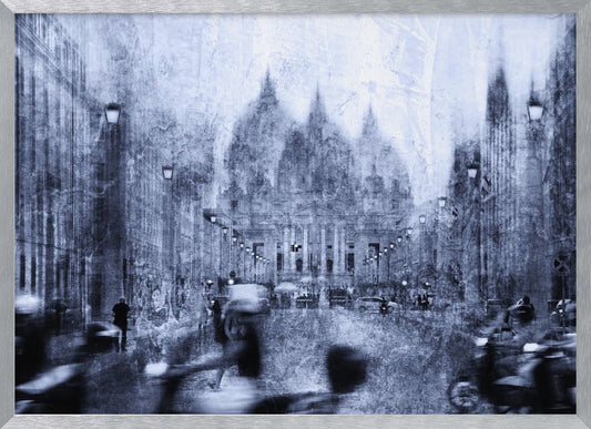 A stylized, heavily textured photograph of a busy city street in shades of blue, grey, and white. A grand, domed building stands at the end of the street, while the figures of people and vehicles in the foreground are blurred with motion, creating a dynamic and atmospheric scene. The entire image has a distressed, weathered appearance and is set within a silver frame. Print