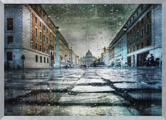 A low-angle, artistic photograph of a wet cobblestone street in Rome leading to St. Peter's Basilica in the distance. The image has a moody, textured feel with an overlay of raindrops, as if viewed through a rainy window, and reflections of the historic buildings in the puddles on the street. Decor