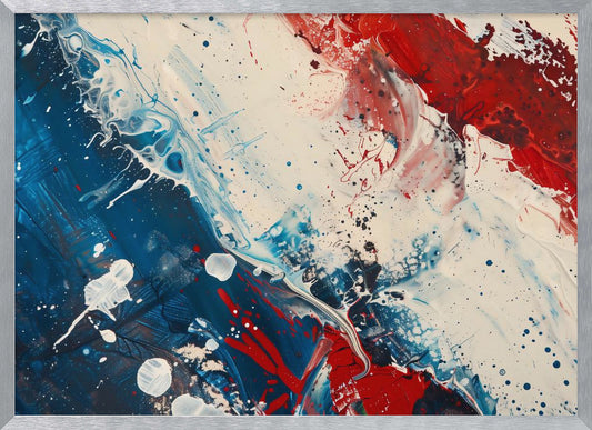 A close-up of an abstract painting in a silver frame, featuring a dynamic composition of red, white, and blue. Thick strokes of paint are splattered and swirled across the canvas, with a large area of deep blue on the left, a bold patch of bright red on the upper right, and a field of off-white in the middle. The piece has a textured, energetic quality. Artwork
