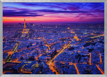 An aerial panoramic view of Paris at dusk, with the cityscape illuminated in cool blue and warm yellow lights. The Eiffel Tower is prominently lit on the left under a dramatic sunset sky transitioning from orange and pink to deep purple. Poster
