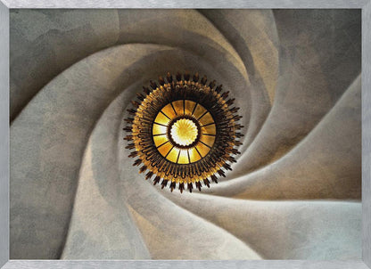 A low-angle, centered photograph looking up at an ornate, golden sunburst chandelier hanging from the vortex of a swirling, textured cream-colored ceiling, enclosed in a silver frame. Poster