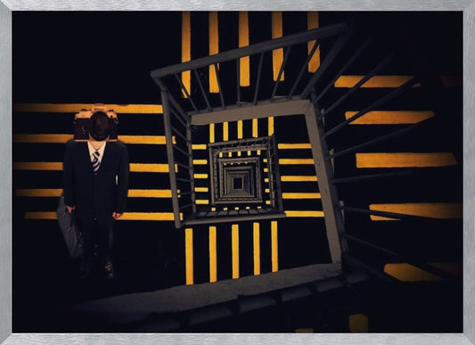 A surreal high-angle view looking down an infinite square spiral staircase with black steps and bold yellow stripes. On a landing stands a man in a dark suit and tie, holding a briefcase, with a vintage camera in place of his head. Artwork