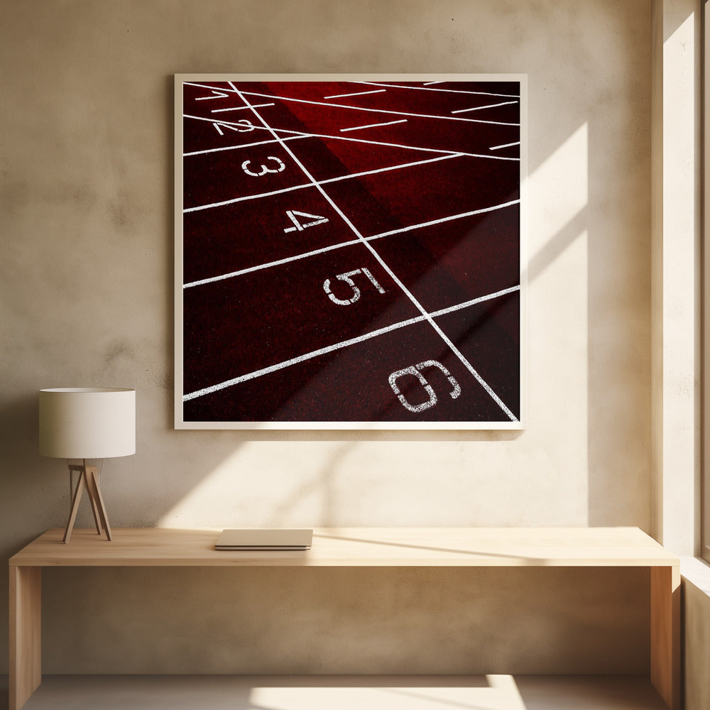 A framed, high-angle photograph of a deep red running track, showing the white lines and numbers for lanes one through six creating a grid-like pattern. Poster