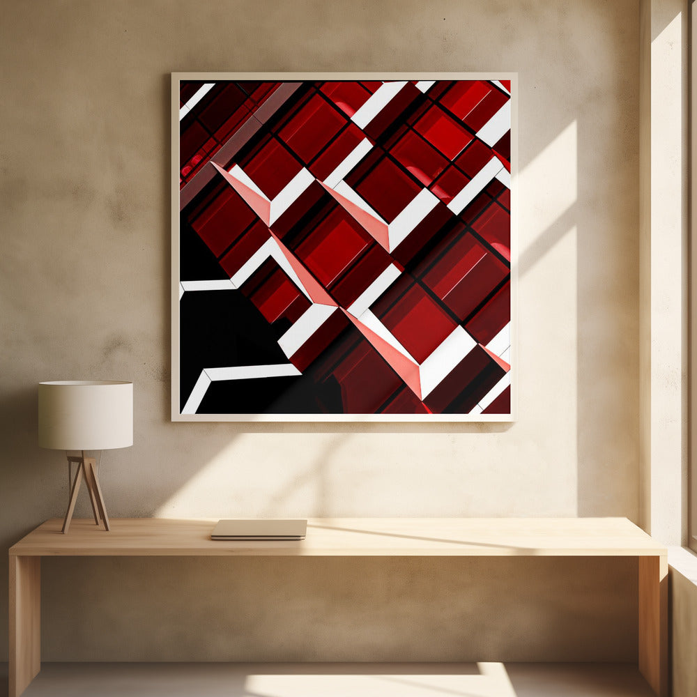 A close-up, angular photograph of a modern building's facade, framed in light wood. The composition is a dynamic geometric pattern of glossy red square panels, stark white lines, and deep black shadows, creating a sense of depth and abstract complexity. Wall Art