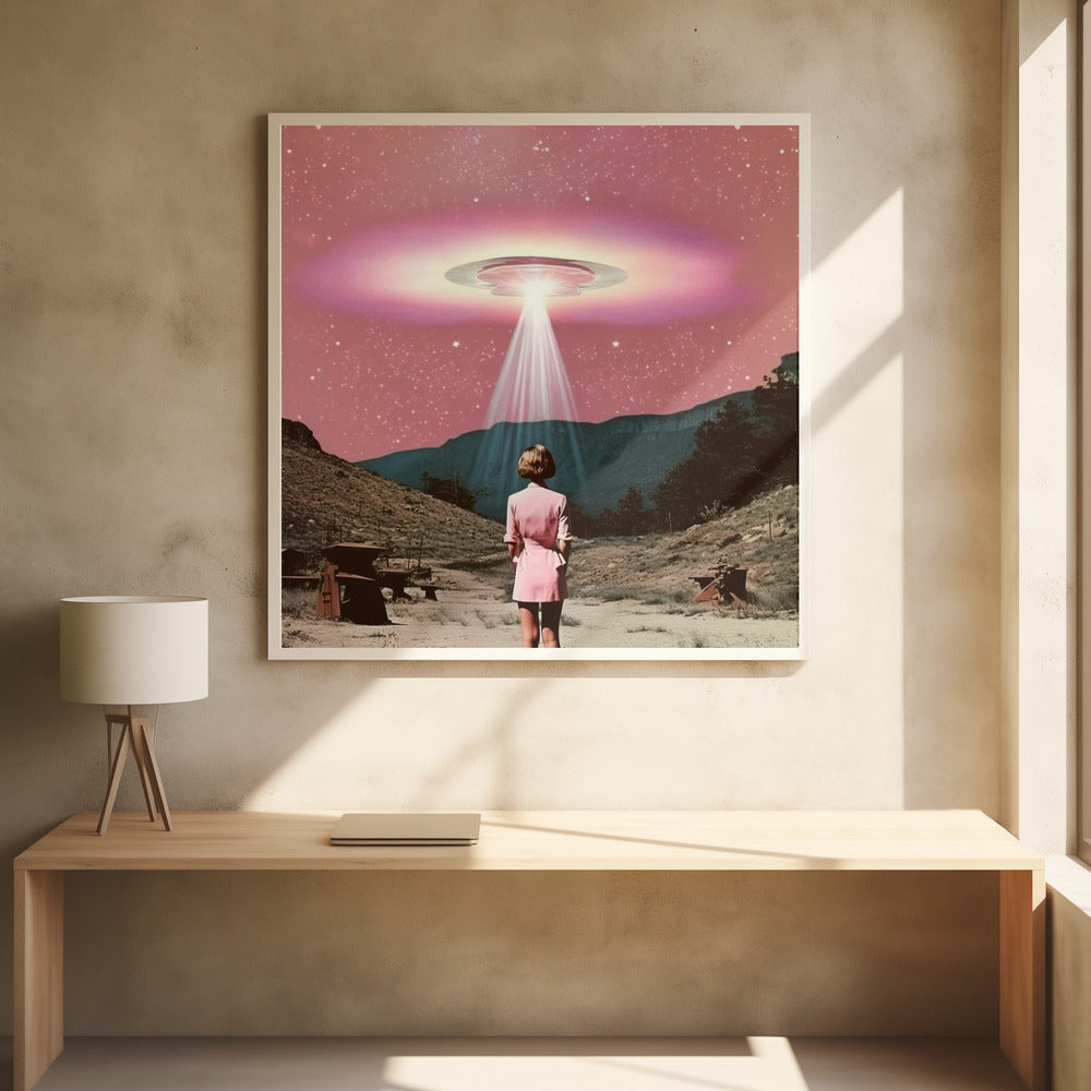 A vintage-style collage artwork in a wood frame depicting a woman in a pink dress standing in a desert landscape, looking up at a large UFO hovering in a pink, starry sky and beaming down a bright light. Print