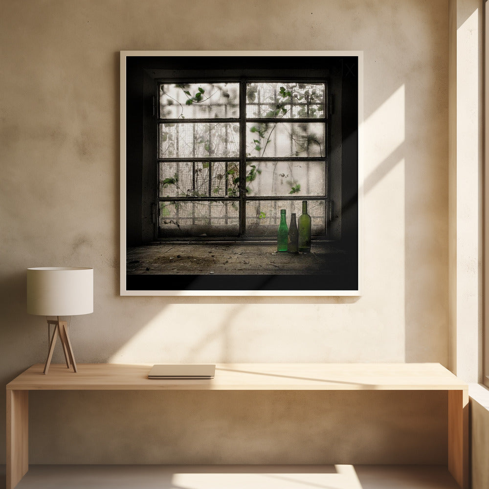 A moody photograph of three dusty green glass bottles sitting on a dirty windowsill in a dark, abandoned room. Behind them, a large, grimy, multi-paned window with wire mesh lets in dim light, revealing the silhouettes of overgrown vines outside. Poster