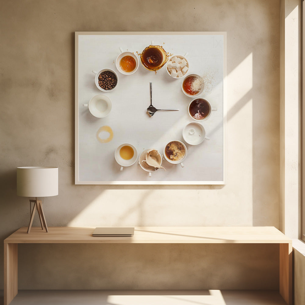 A creative flat lay photograph of a clock made from coffee cups and ingredients. Twelve white cups are arranged in a circle on a white background, each representing an hour and filled with different coffee-related items like beans, honey, sugar cubes, and various stages of coffee with milk splashing. In the center, two silver spoons form the hands of the clock. The entire image is presented within a light wood frame. Decor