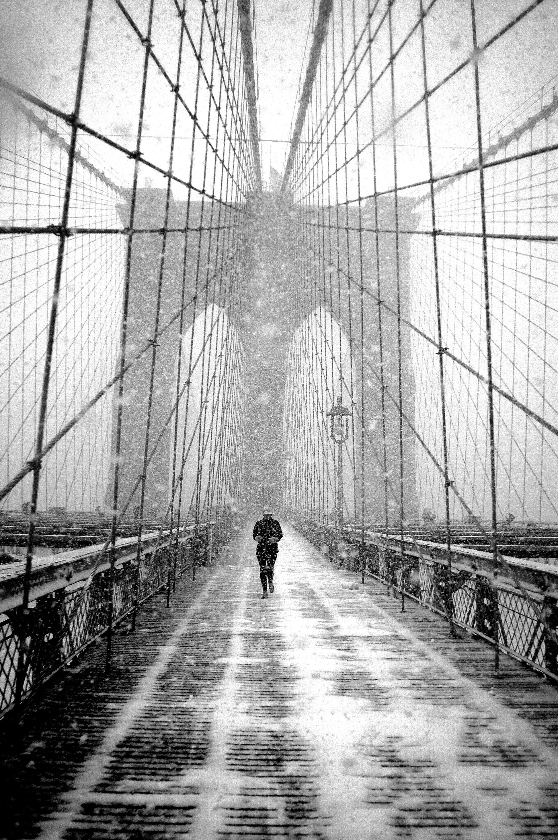 New York Walker in Blizzard - Brooklyn Bridge - Poster / Art Print
